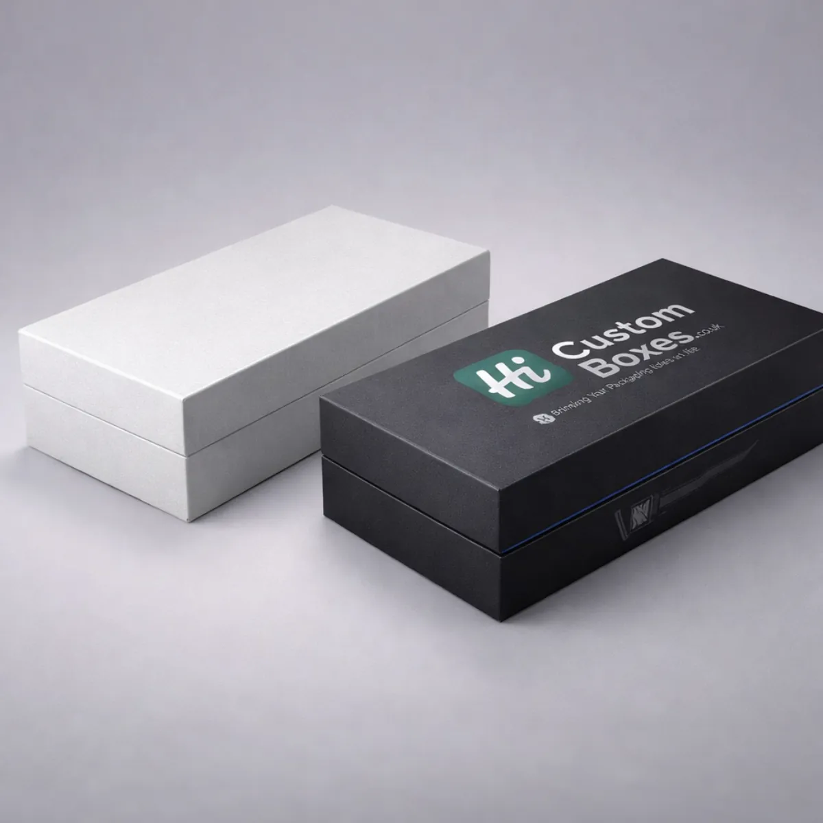 Minimalist black and white rigid gift boxes for electric trimmers with premium matte finish branding. class=